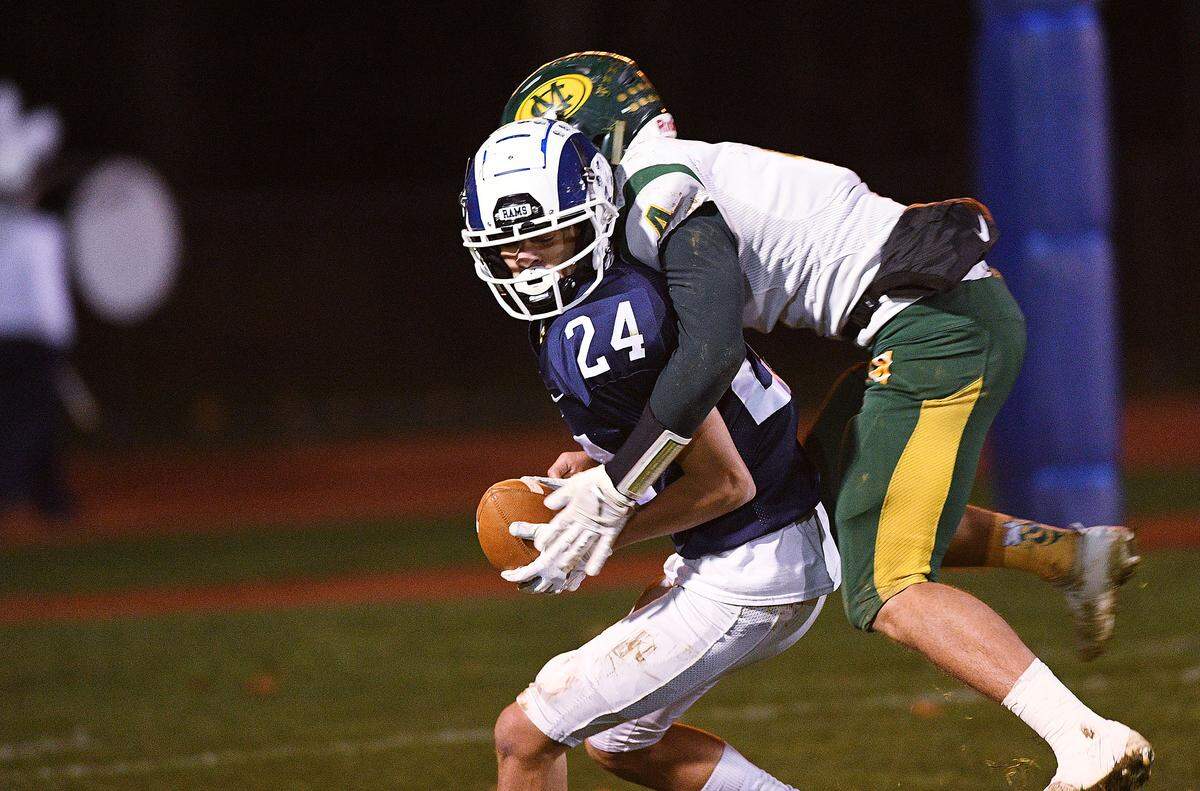 Penns Valley’s Stephen Ripka (22) catches a pass for a touchdown as Marion Center defender Gaven Palko (4) defends during Saturday night’s PIAA District  6 football playoffs at Penns Valley.  (For the CDT/Steve Manuel)
