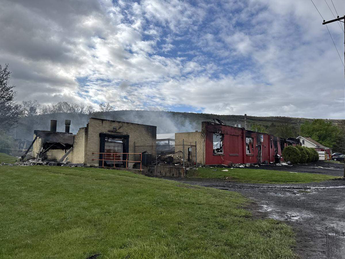 An overnight fire destroyed G.P. Cabinets in Howard, and was still smoldering Thursday morning.