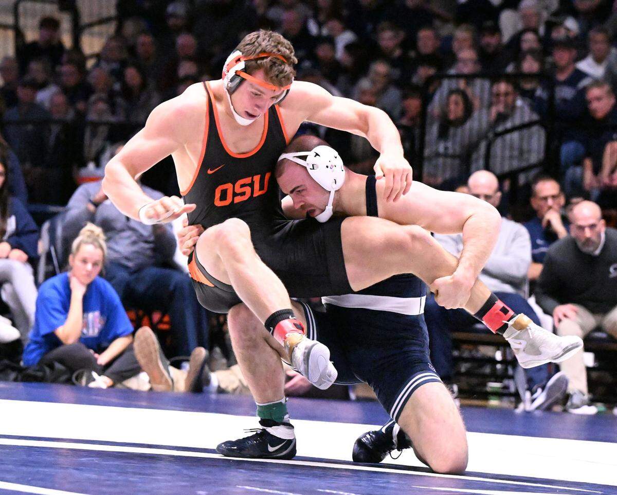 Penn State’s Max Dean takes down Oregon State’s Tanner Harvey in the 197-pound bout on Sunday, Dec. 11, 2022 at Rec Hall in State College. Dean defeated Harvey 6-3. Penn State defeated Oregon State, 31-3.