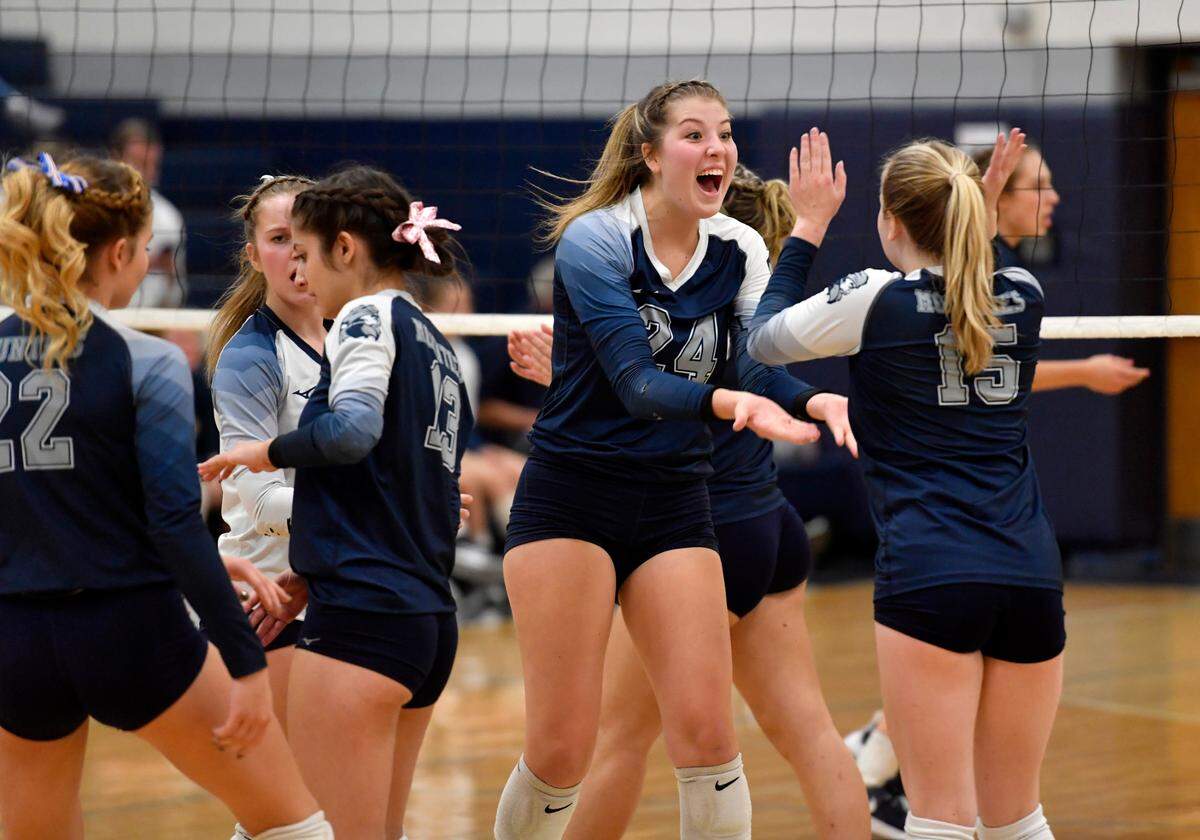 Philipsburg-OsceolaÕs Reese Hazelton and Kalista Butler celebrate a point during the District 6 2A semi-final game against Bald Eagle Area on Thursday, Nov. 4, 2021.