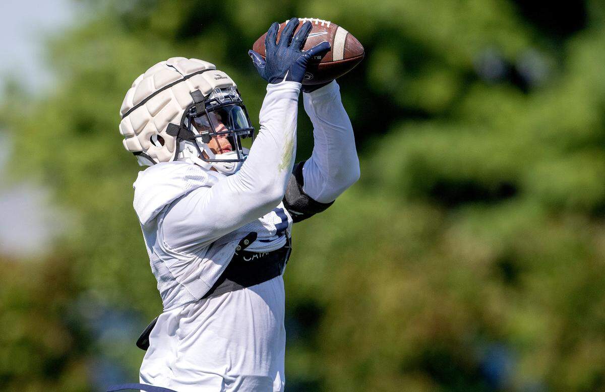 Penn State wide receiver Parker Washington makes a catch during practice on Saturday, Aug. 20, 2022.