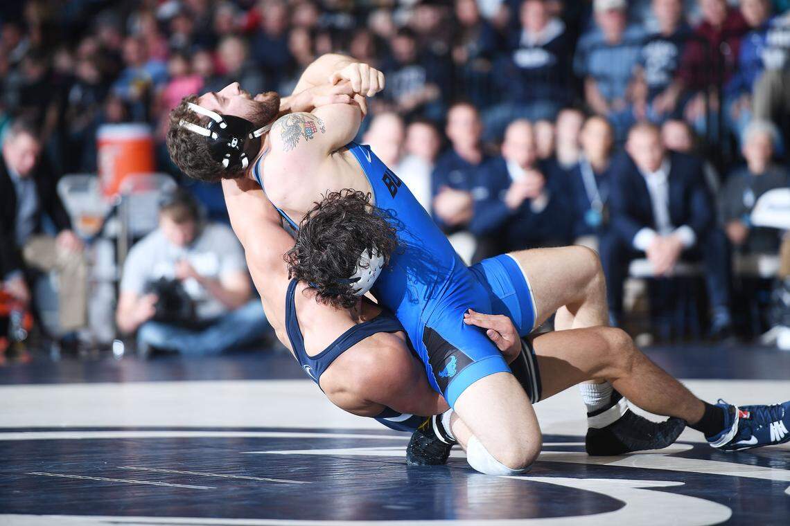 Penn State’s Shakur Rasheed (rear) takes down Buffalo’s Joe Ariola during their 197-pound bout at Rec. Hall last season.  Rasheed pinned Ariola for the win.
