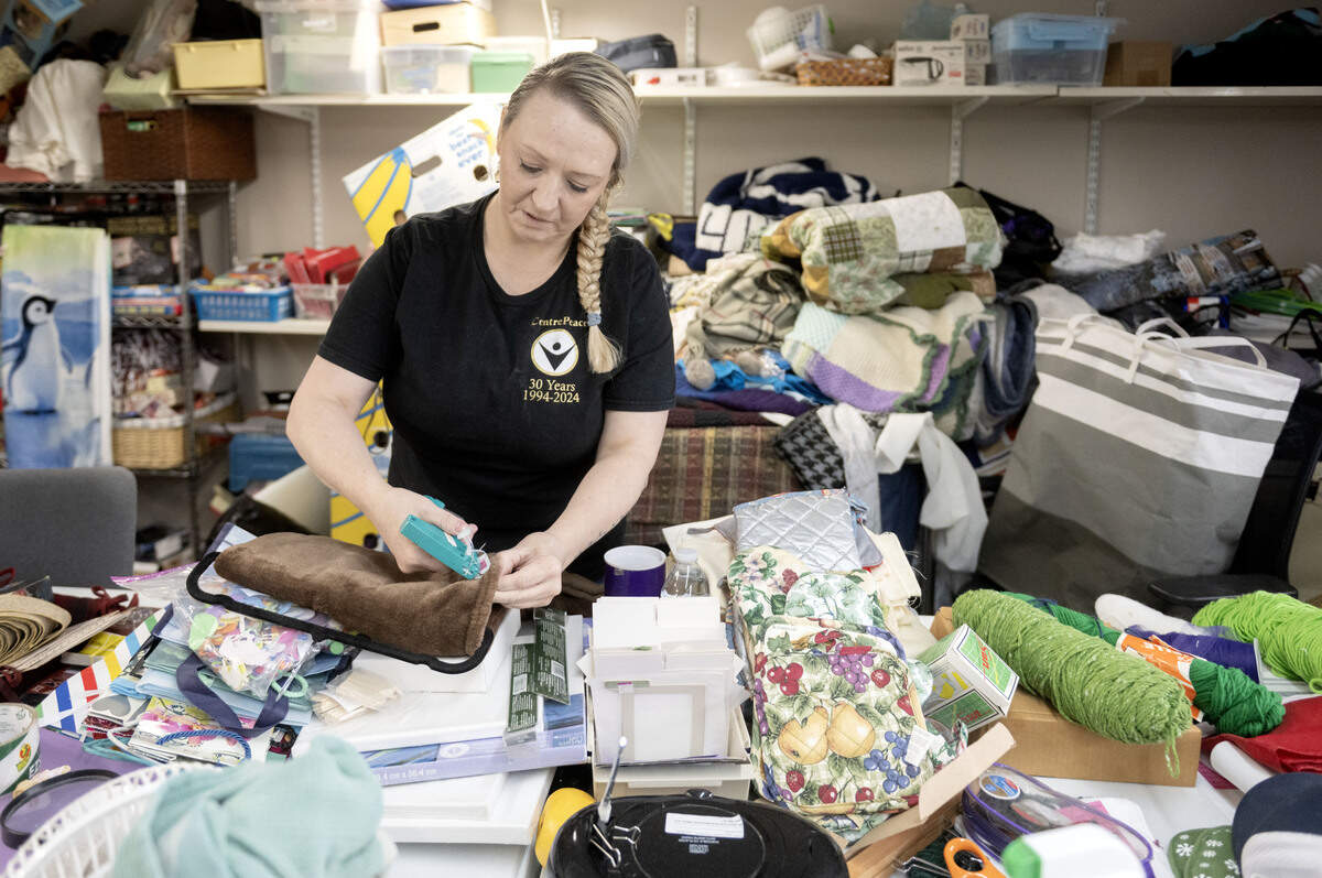 Sandy Tomcavage folds and prices linens at CentrePeace on Tuesday, June 23, 2026.