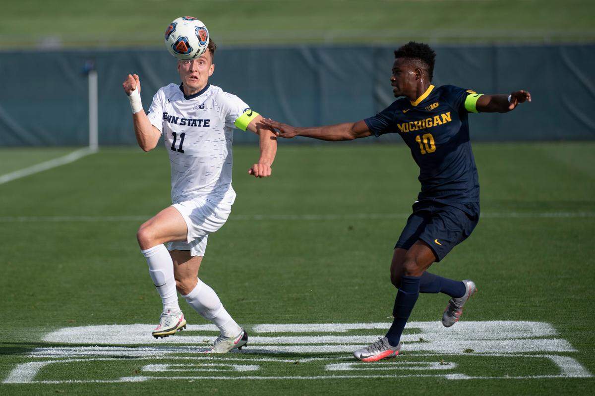 Penn State midfielder Pierre Reedy (11) heads the ball during the Big Ten Men’s Soccer Tournament Quarterfinal match at the Jeffrey Field on Wednesday, April 14, 2021 in State College, PA. The Nittany Lions defeated Michigan 4-1 to move on to the Big Ten Tournament Final.