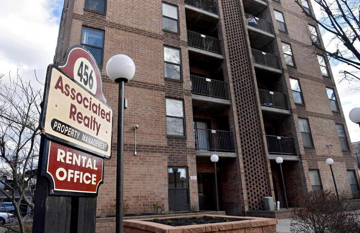 A sign for the Associated Realty Property Management rental office in front Beaver Terrace on Beaver Avenue in downtown State College on Wednesday, April 1, 2020.