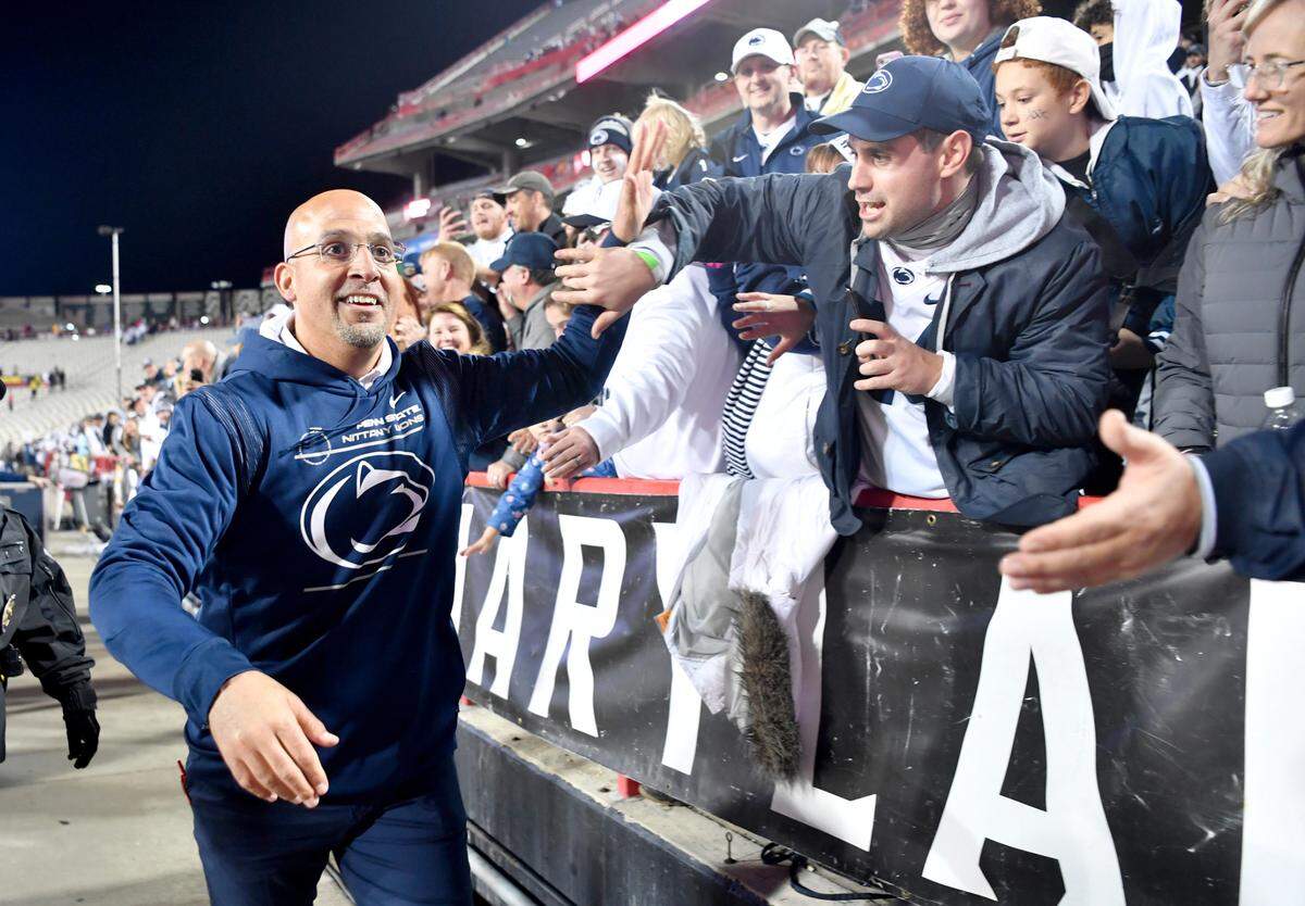 Penn State football coach James Franklin high fives fans after the 31-14 win over Maryland on Saturday, Nov. 6, 2021.