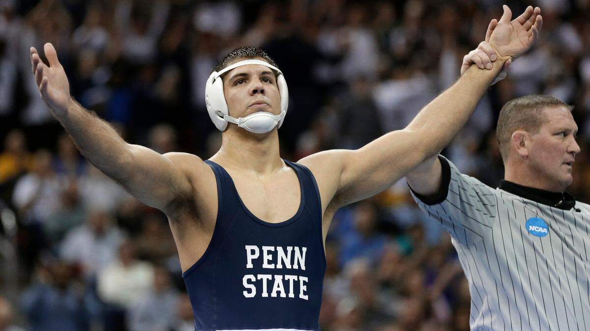 Penn State’s Quentin Wright reacts after beating Kent State’s Dustin Kilgore in the 197-pound title match at the NCAA Division I wrestling championships, Saturday, March 23, 2013, in Des Moines, Iowa.