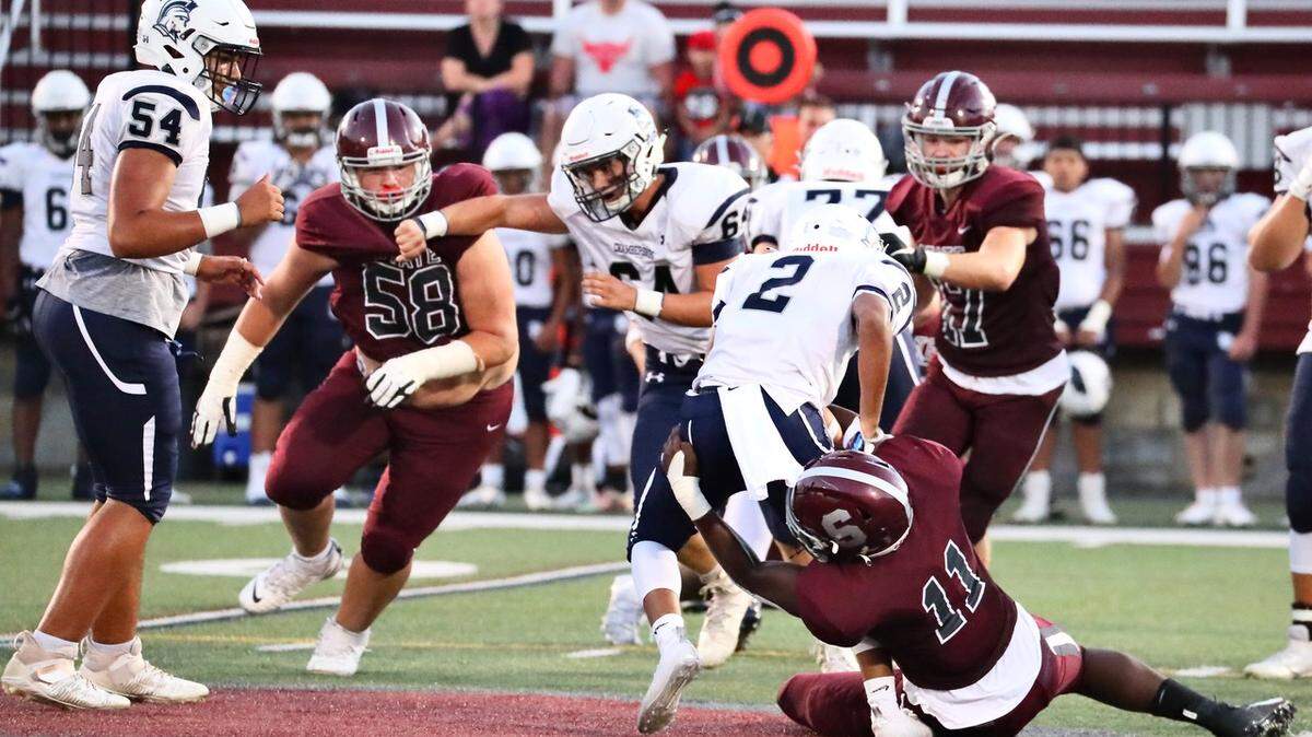 State College’s John Scott pulls down a Chambersburg player at Memorial Field on Sept. 17, 2021. State College won, 38-22.