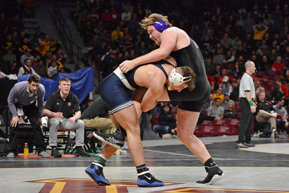 Penn State heavyweight Anthony Cassar shoots in on a single-leg on Northwestern’s Conan Jennings in the semifinals of the Big Ten Wrestling Championships on Saturday in Williams Arena in Minneapolis.