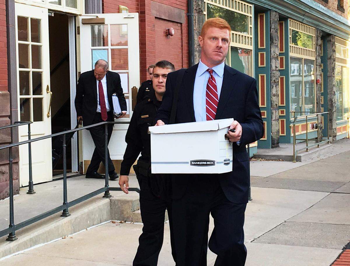 Former Penn State assistant football coach Mike McQueary leaves the Centre County Courthouse Annex on Oct 17, 2016 after the first day of his whistleblower lawsuit trial against the university.