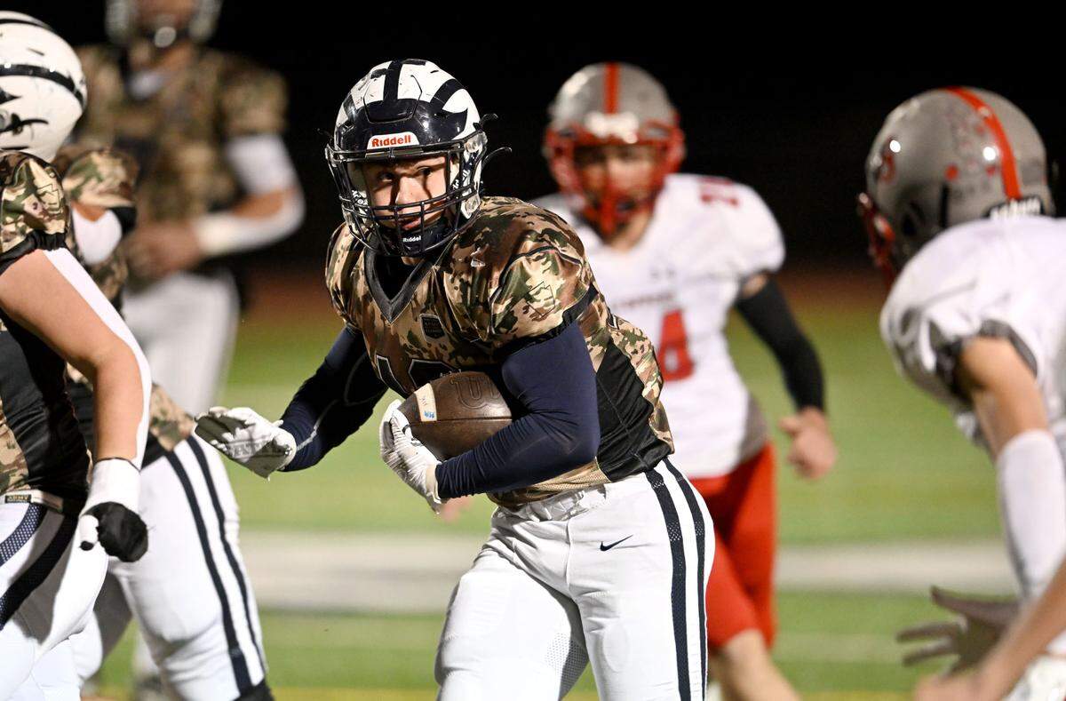Philipsburg-Osceola’s Colton Chapman cuts down the field with the ball from a Westmont Hilltop defender during the game on Friday, Oct. 11, 2024.