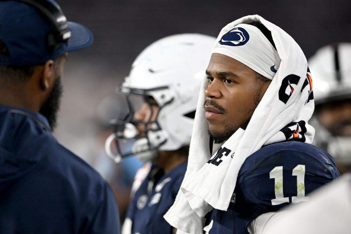 Penn State defensive end Abdul Carter talks to Deion Barnes as he stands on the side lines in the second half of the Fiesta Bowl on Tuesday, Dec. 31, 2024 at State Farm Stadium.