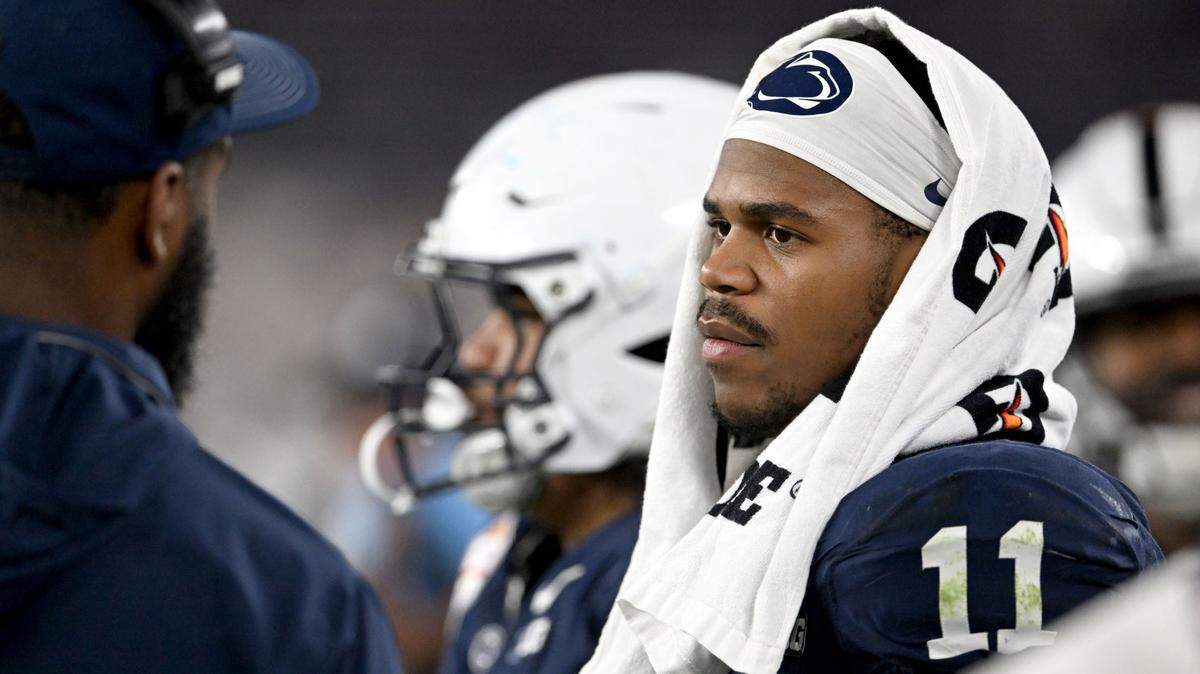 Penn State defensive end Abdul Carter talks to Deion Barnes as he stands on the side lines in the second half of the Fiesta Bowl on Tuesday, Dec. 31, 2024 at State Farm Stadium.