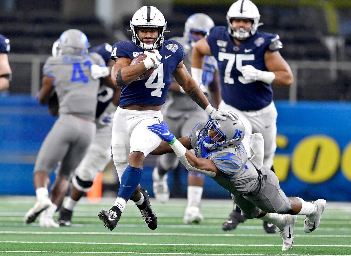 Memphis defensive back Quindelle Johnson cant’s stop Penn State running back Journey Brown during the Cotton Bowl at AT&T Stadium in Arlington, TX on Saturday, Dec. 28, 2019.