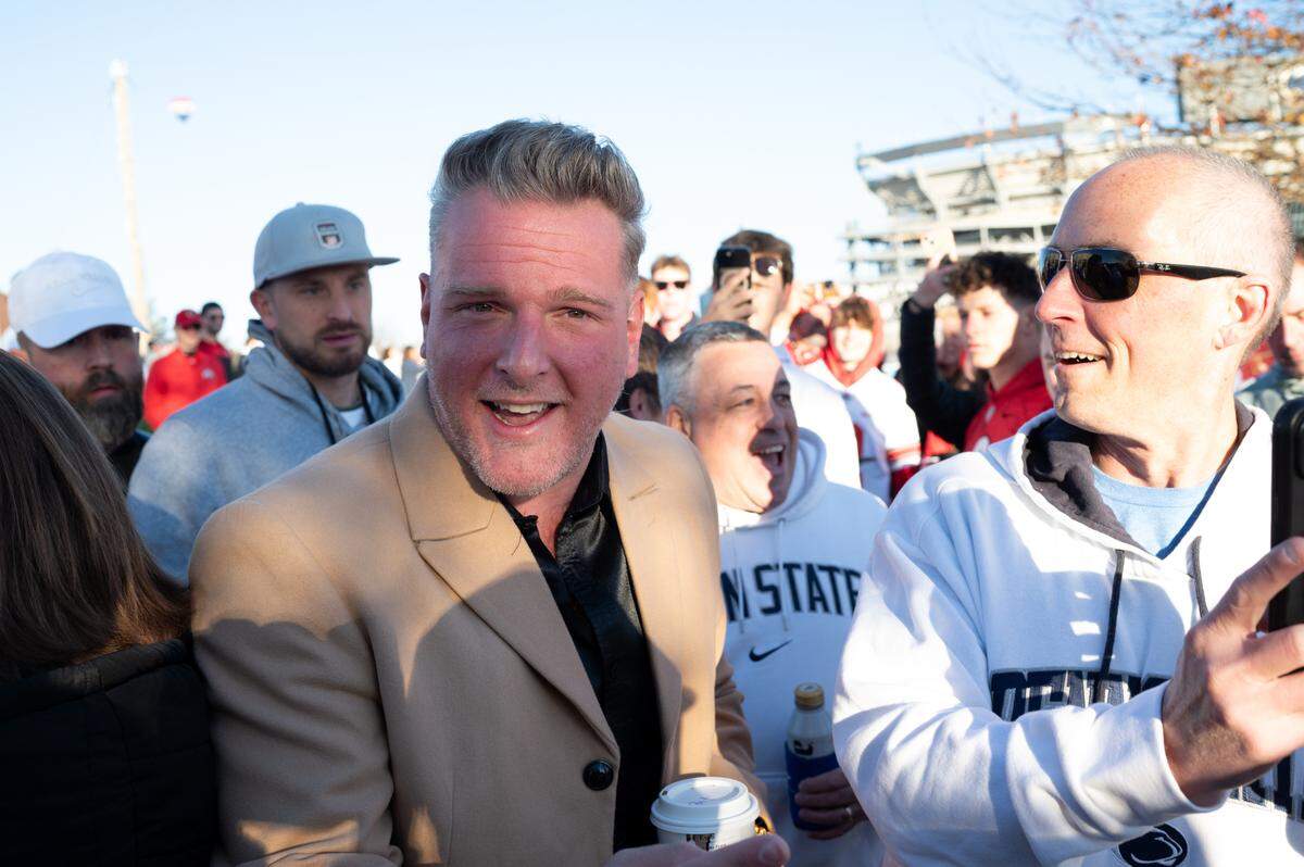 Pat McAfee is crowded by fans as he walks onto set for ESPN College GameDay on Saturday, Nov. 2, 2024