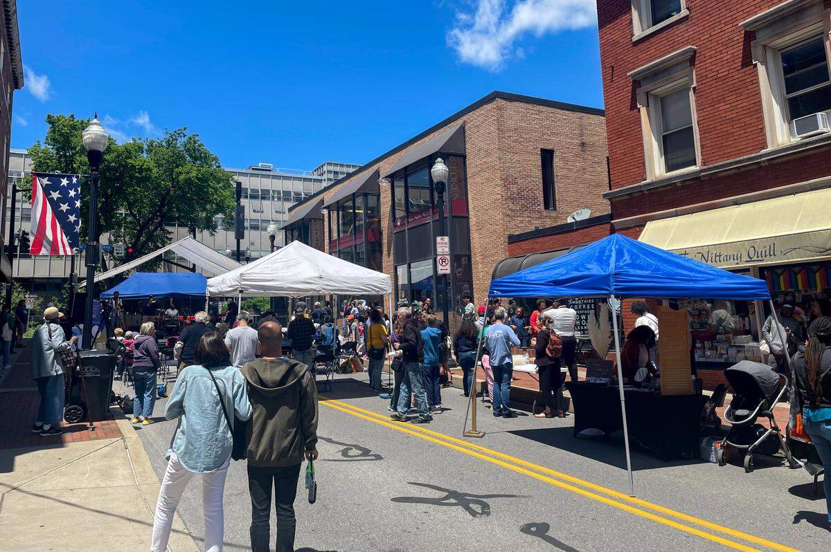 Crowds gather on South Fraser Street during Saturday afternoon’s Juneteenth block party.