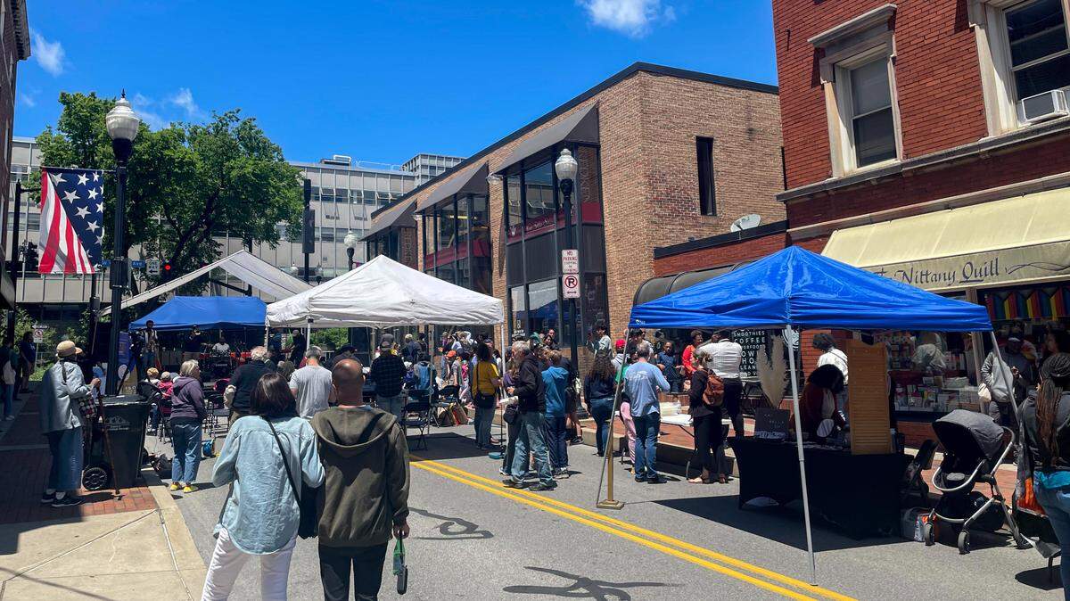 Crowds gather on South Fraser Street during a June 18, 2022 Juneteenth block party.
