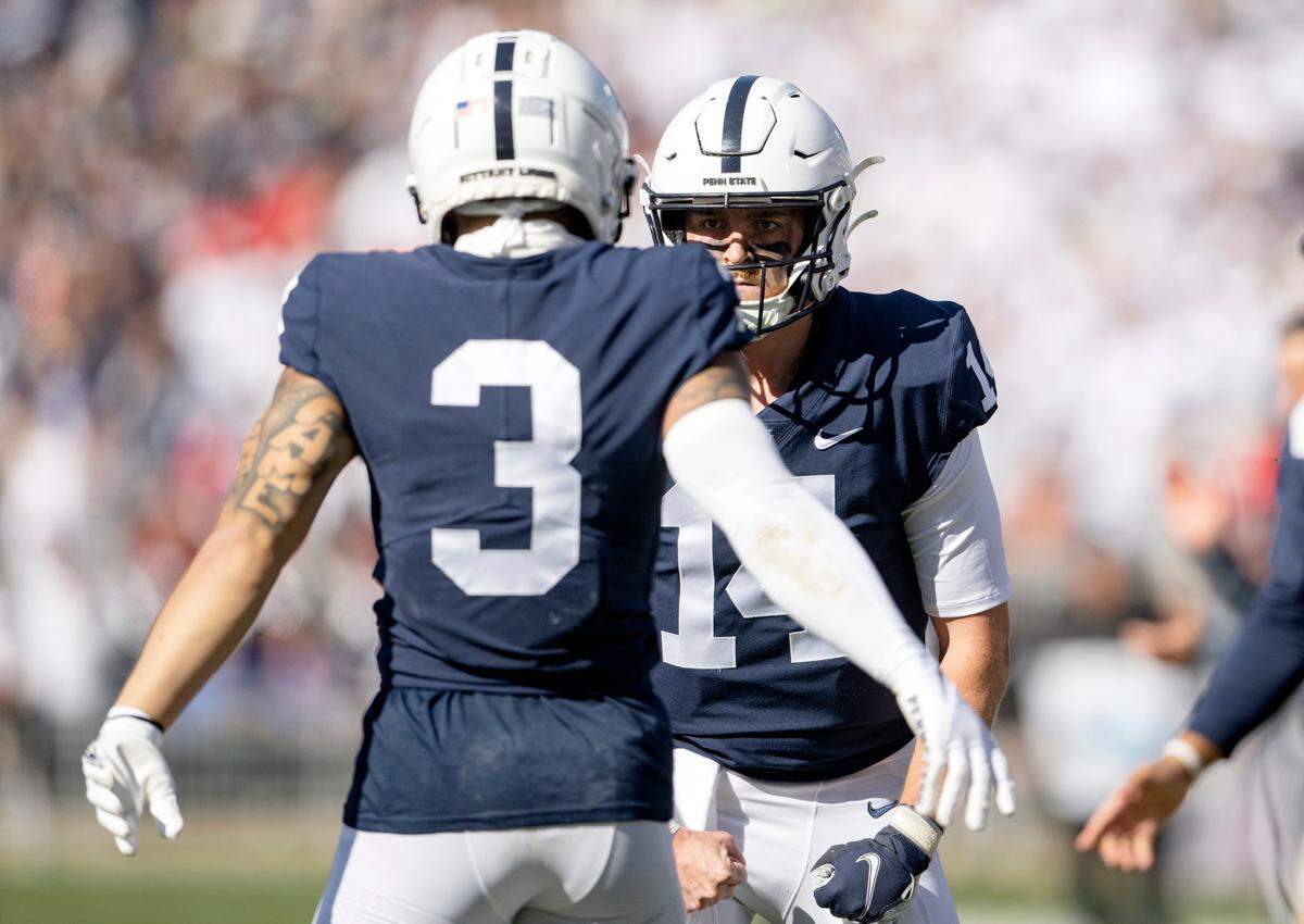 Penn State quarterback Sean Clifford congratulates wide receiver Parker Washington after a touchdown during the game against Ohio State on Saturday, Oct. 29, 2022.