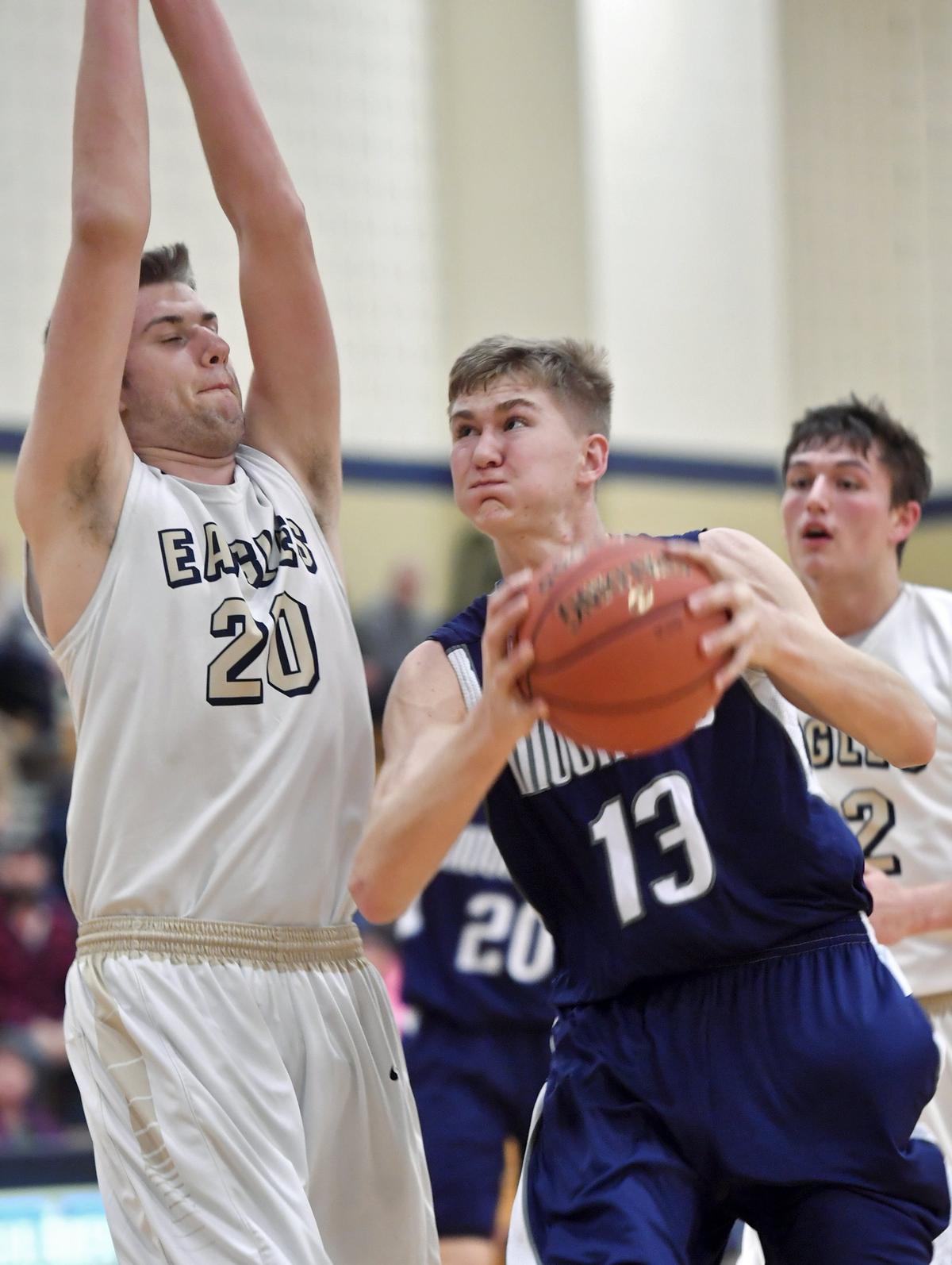 Philipsburg-Osceola’s Ryan Whitehead tries to go in for a basket around Bald Eagle Area’s Drew Bucha during the game on Tuesday, Jan. 29, 2019.