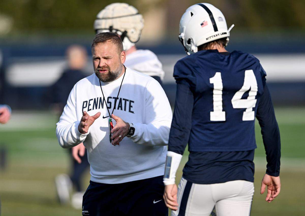 Penn State offensive coordinator Andy Kotelnicki talks to quarterback Jaxon Smolik during spring practice on Tuesday, March 12, 2024.