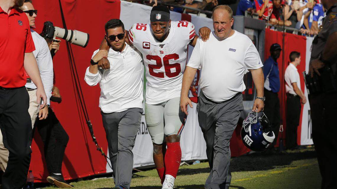 RB Saquon Barkley to undergo MRI after right ankle injury, per ESPN report