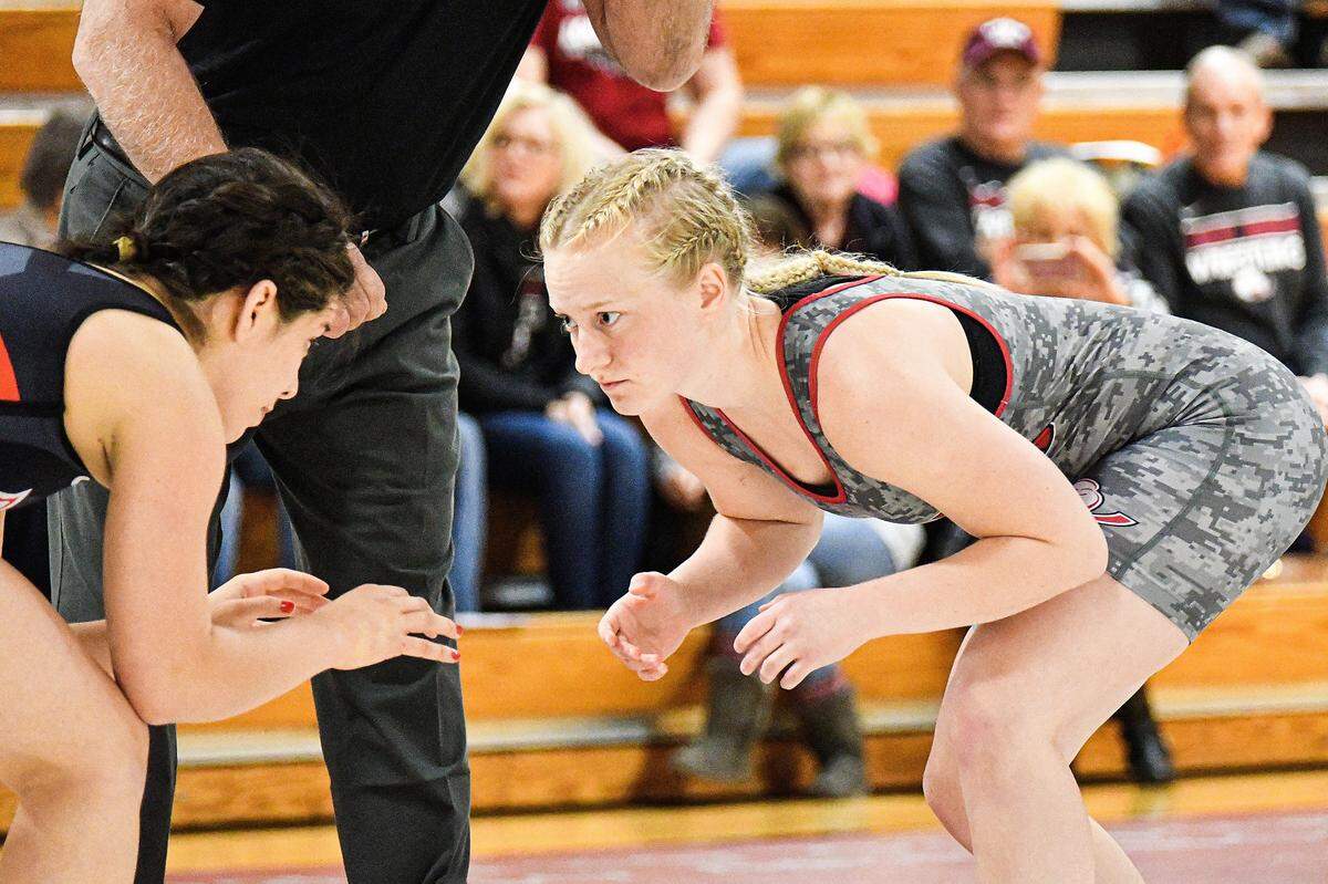 Lock Haven’s Dallis Dillon, of Howard, wrestles East Stroudsburg’s Josselinne Campos in an exhibition match Thursday at Thomas Fieldhouse. This was the first live competition for LHU’s newly formed women’s wrestling program.