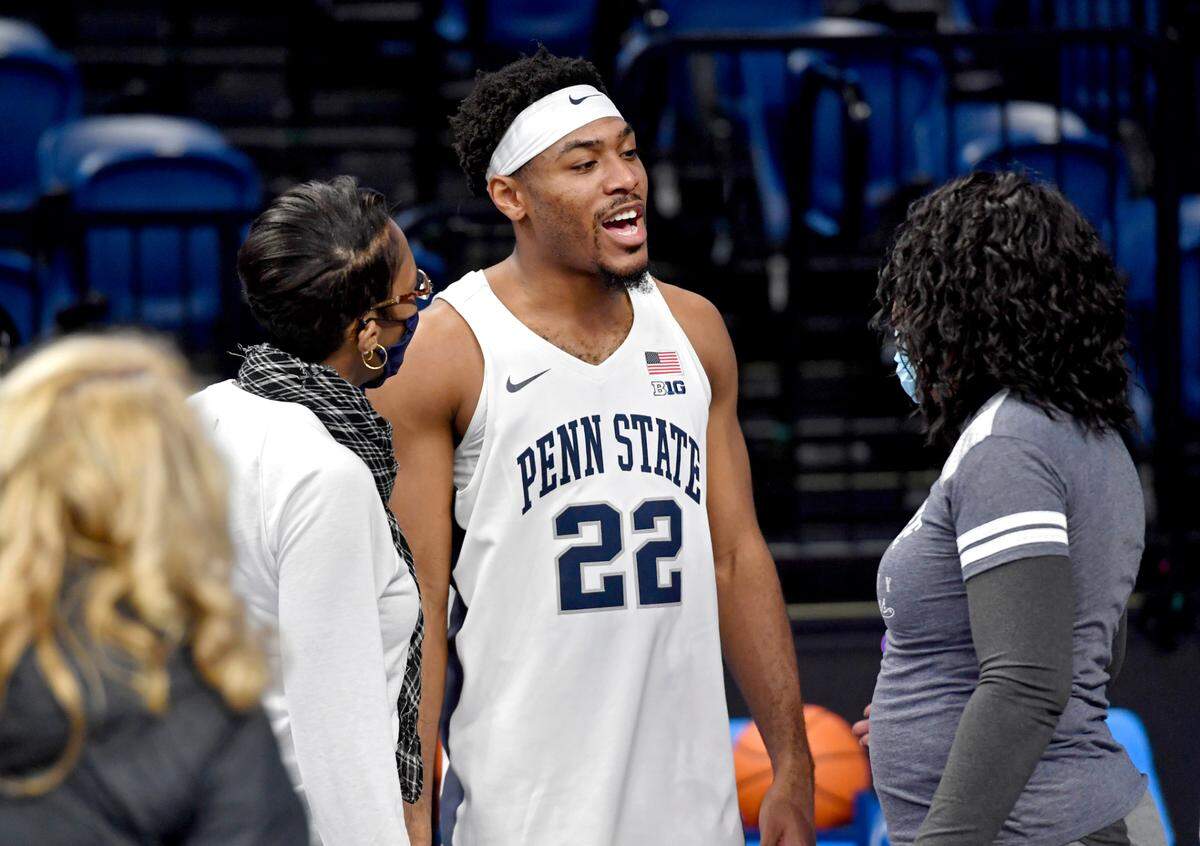 Penn State’s Jalen Pickett talks with family after the win Iowa on Jan. 31 at the Bryce Jordan Center.