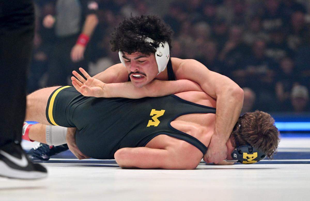 Penn State’s Beau Bartlett controls Michigan’s Sergio Lemley in the 141 lb bout of the match on Friday, Feb. 7, 2025 in the Bryce Jordan Center.