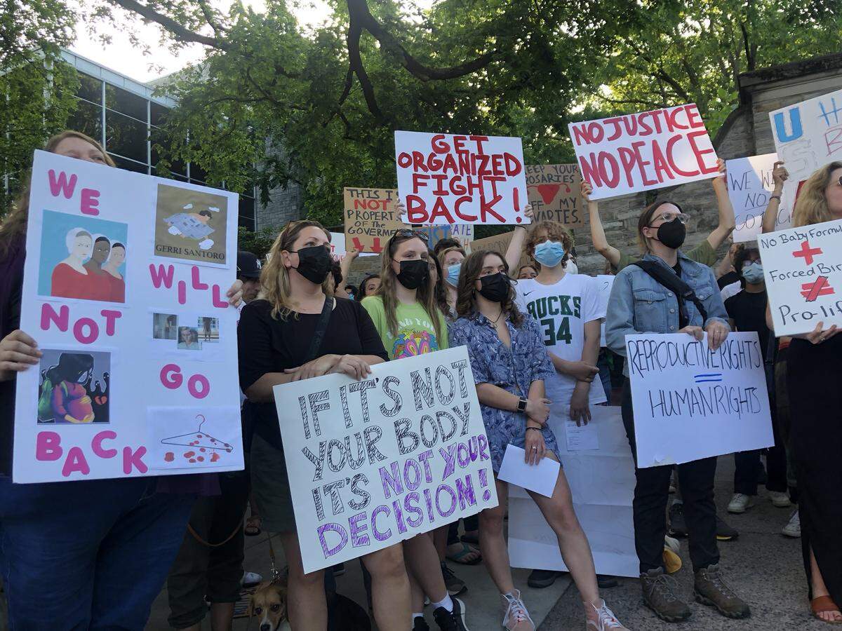 A group of protesters gathers at the Allen Street Gates in State College on Friday, June 24, 2022, after the U.S. Supreme Court overturned Roe v. Wade.
