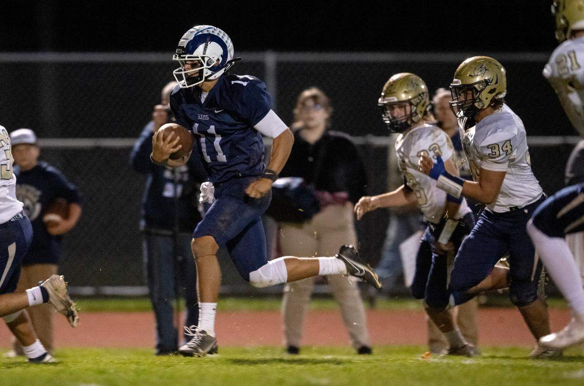 Penns Valley’s Jackson Romig runs from Bald Eagle Area defenders for a touchdown during the game on Thursday, Nov. 10, 2022.