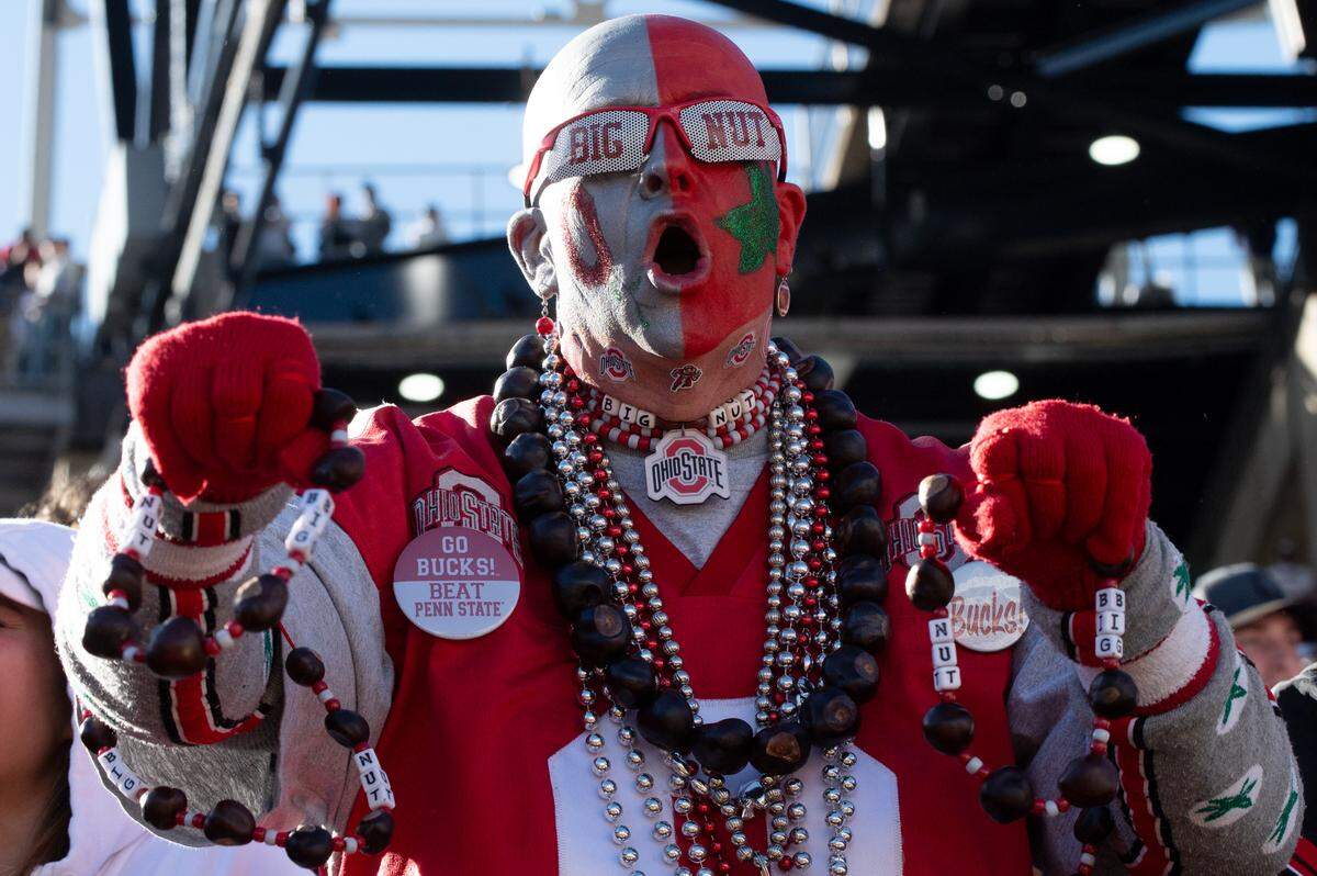 An Ohio State fan celebrates as the football game between Penn State and Ohio State comes to a close at Beaver Stadium on Saturday, Nov. 2, 2024. The Nittany Lions lost to the Buckeyes 20-13.