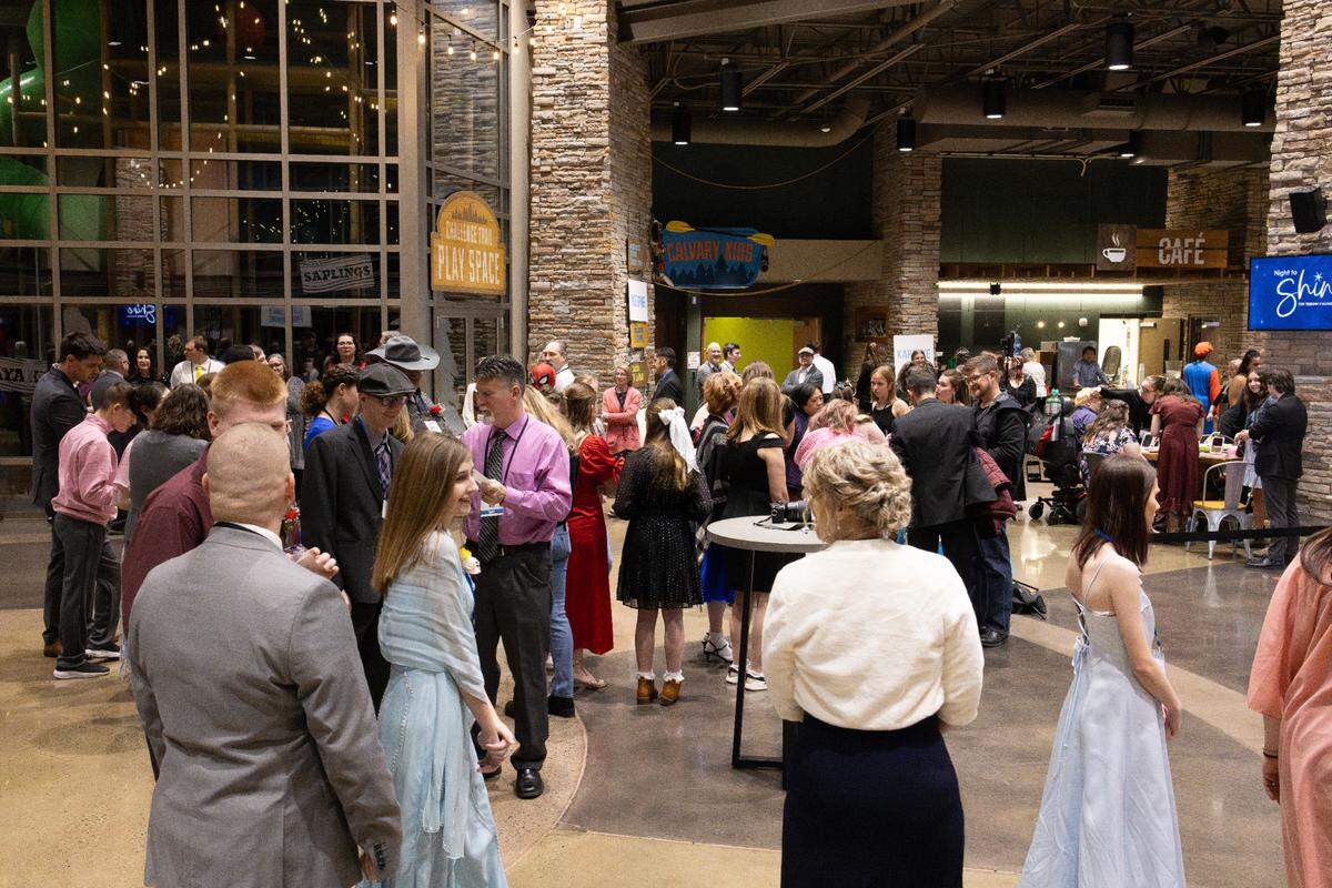 Guests fill the lobby of of Calvary Harvest Fields Church for Night to Shine on Friday, Feb. 7, 2025.