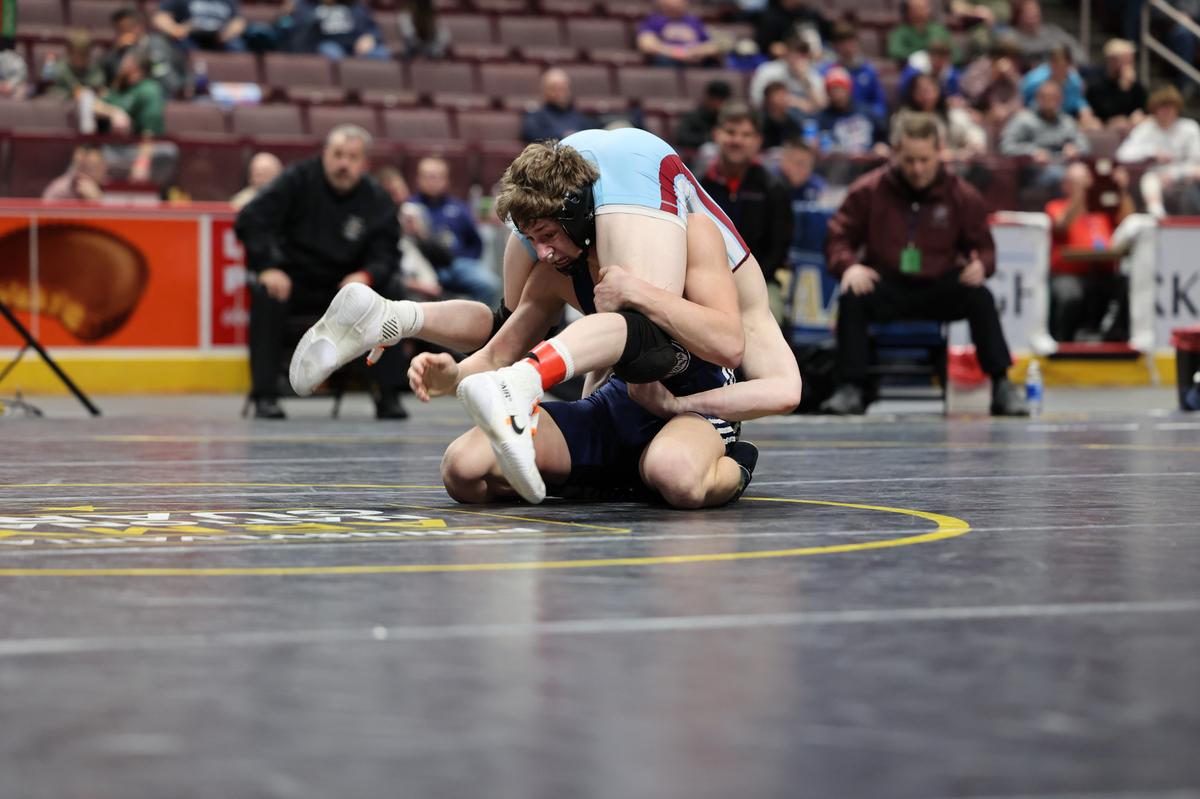 Penns Valley’s Ty Watson aims to finish off a takedown of Faith Christian Academy’s Cael Weidemoyer in their 152-pound consolation semifinals match of the PIAA Class 2A Championships on Friday, March 10, 2023 at the Giant Center in Hershey. Weidemoyer topped Watson, 8-6.