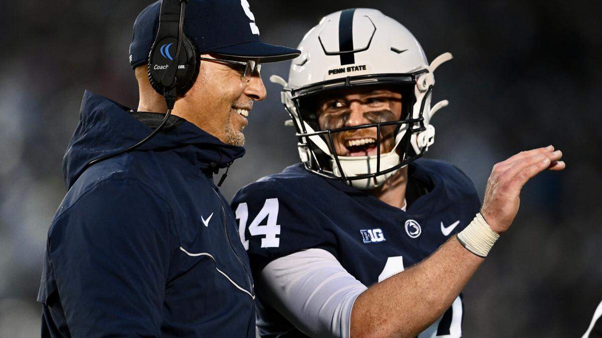 Penn State quarterback Sean Clifford laughs with heach coach James Franklin during the game against Maryland on Saturday.
