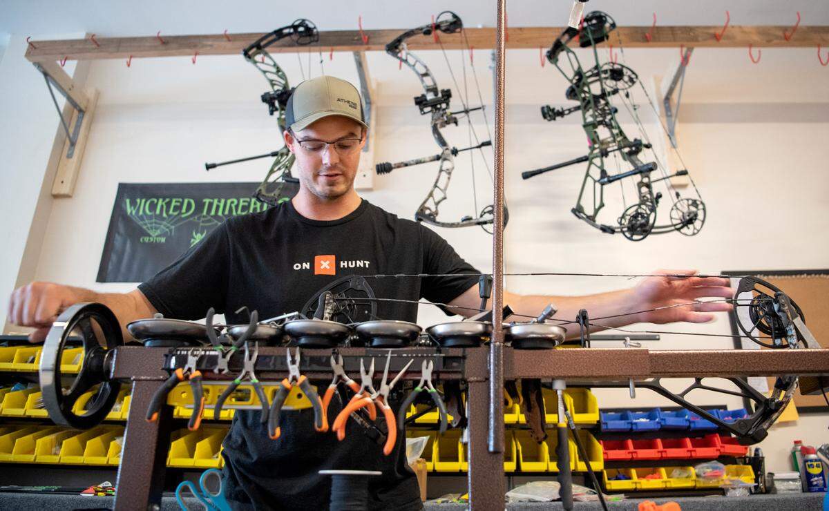 Nate Sellers works on a bow in his new shop Average Jack Archery works in Philipsburg on Tuesday, July 5, 2022.