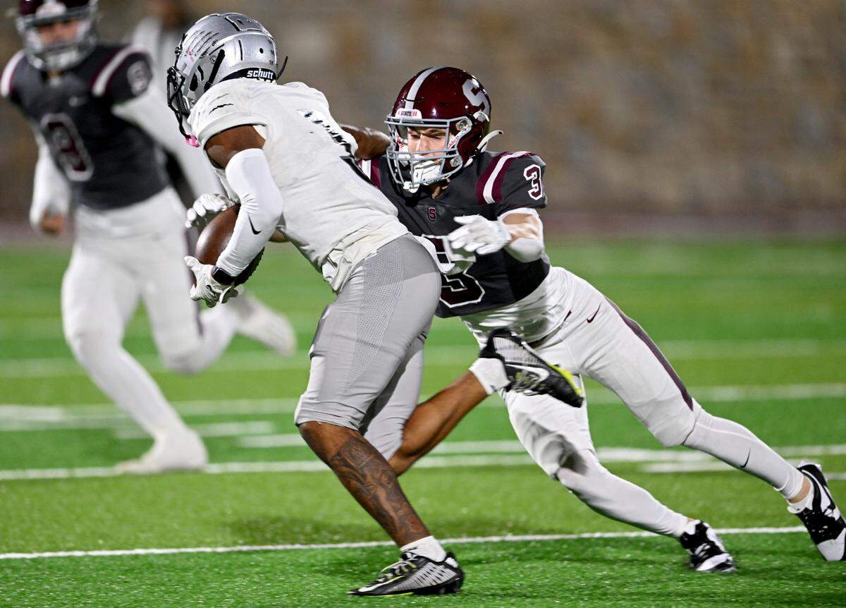 State College’s Ty Salazer stops Harrisburg’s Kymir Williams during the game on Friday, Oct. 13, 2023.