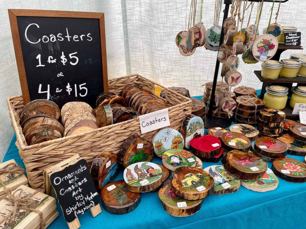 Morton Woodworking out of Erie, Pennsylvania, sells handcrafted items at Arts Fest, including these coasters and ornaments.