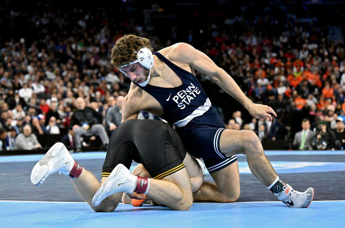 Penn State’s Mitchell Mesenbrink wrestles Iowa’s Mike Caliendo in the 165-pound championship bout of the 2025 NCAA Wrestling Championships at the Wells Fargo Center in Philadelphia on Saturday March 22, 2025.  