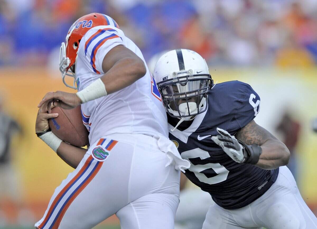 Gerald Hodges wraps up Florida’s Jordan Reed during the Outback Bowl at Raymond James Stadium in Tampa, Fla. on Saturday, January 1, 2011.