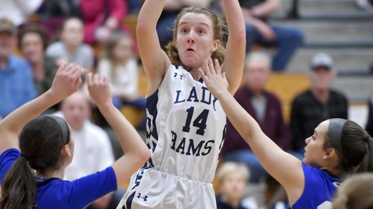 Penns Valley’s Hannah Montminy shoots for a basket over South Park defenders during the game on Friday, March 8, 2019.