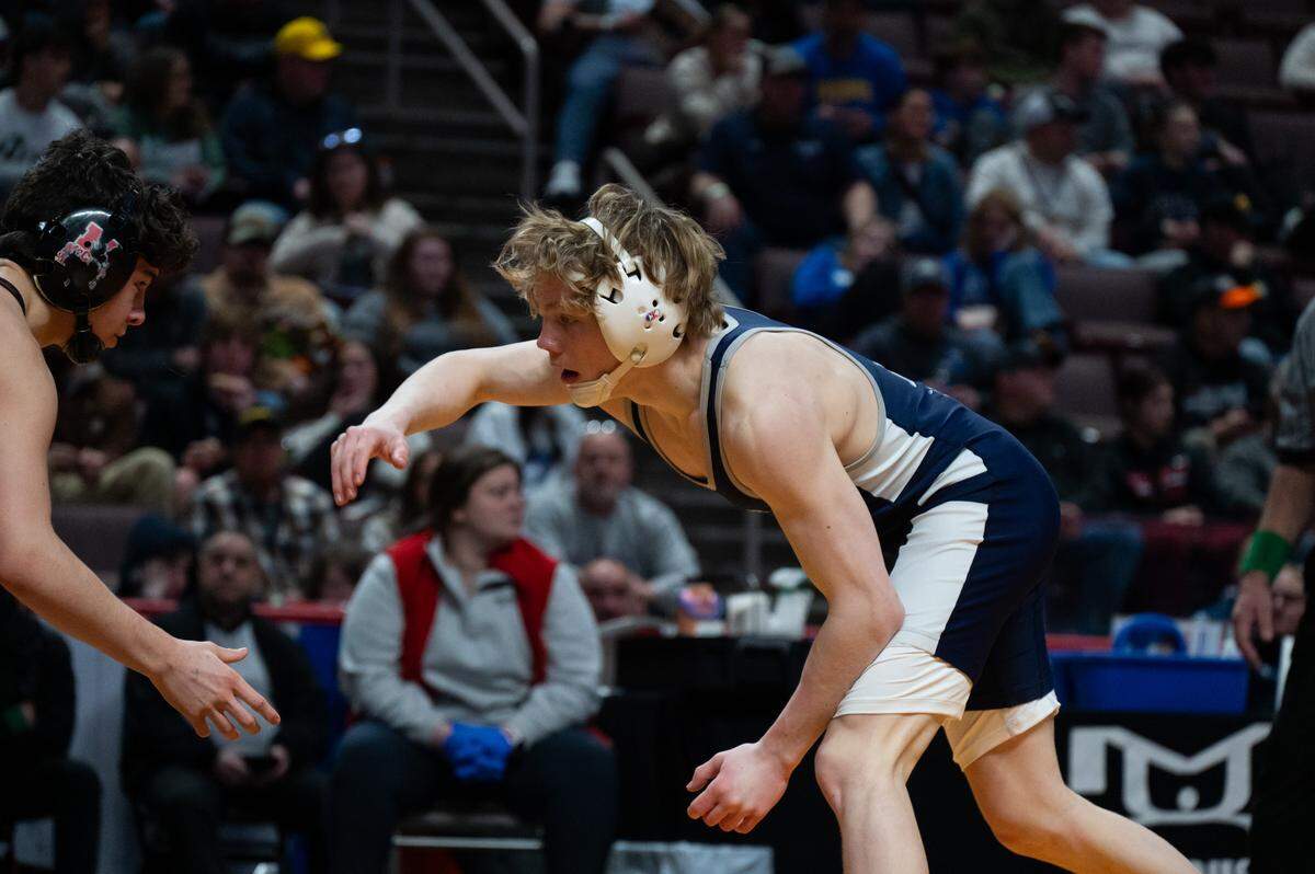 Penns Valley's Max Dinges wrestles Bishop McCort's Keegan Bassett in the 121-pound finals of the PIAA Class 2A Wrestling Championships on Saturday, March 7, 2026 in the Giant Center in Hershey, Pa. Bassett won by decision 4-2.