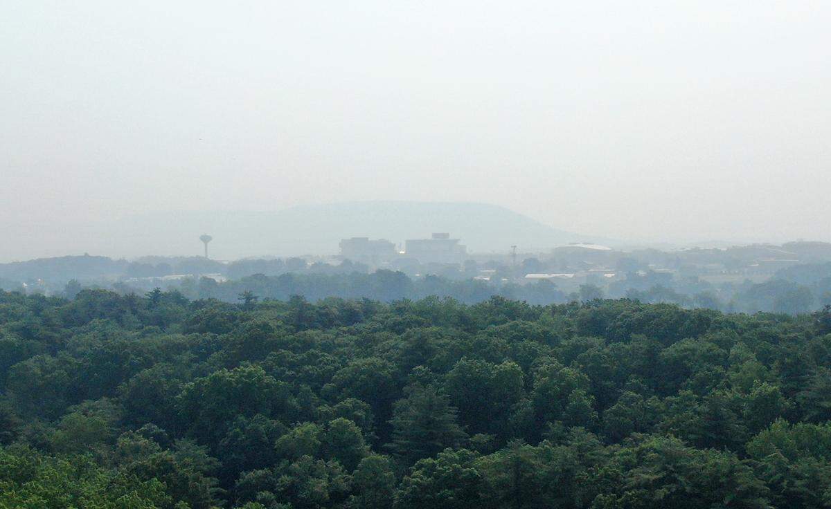 Beaver Stadium and Mount Nittany are seen through smokey skies on Wednesday, June 7, 2023.