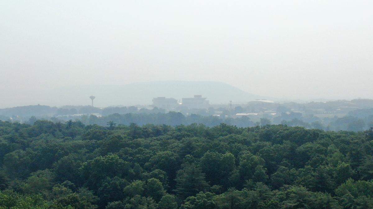Beaver Stadium and Mountain Nittany through smokey skies on Wednesday, June 7, 2023.