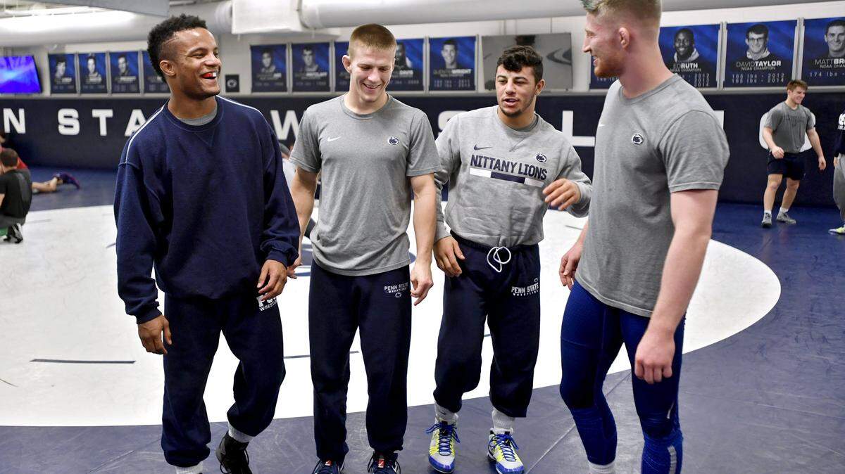 Past NCAA champions Mark Hall, Jason Nolf, Vincenzo Joseph and Bo Nickal laugh together during Penn State wrestling media day on Tuesday, Nov. 6, 2018.