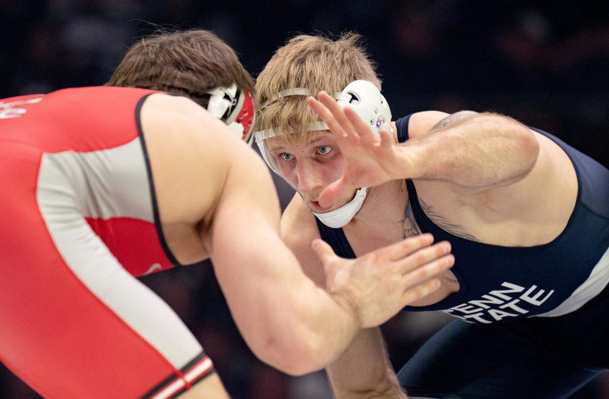 Penn State's Josh Barr reaches for Ohio State’s Luke Geog during the 197 lb bout of the match on Friday, Feb. 13, 2026 at the Bryce Jordan Center.