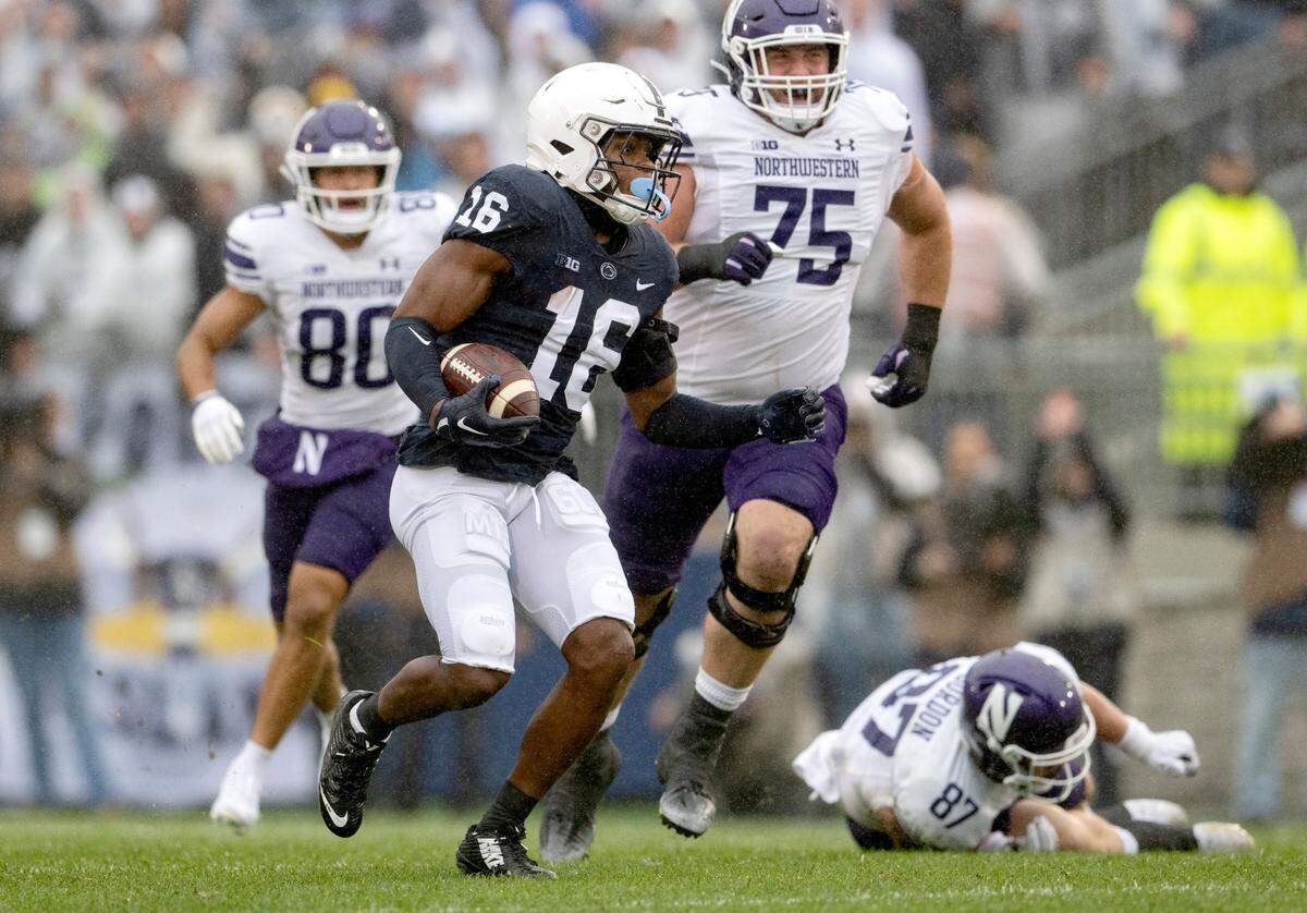 Penn State safety Ji’Ayir Brown makes an interception and runs down the field with the ball during the game against Northwestern on Saturday, Oct. 1, 2022.