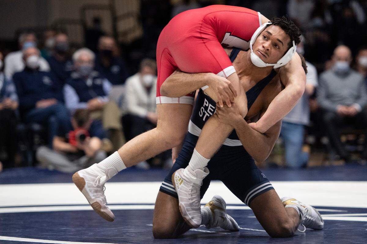 Penn State’s Carter Starocci grabs his opponent during a wrestling dual between Penn State and Rutgers on Sunday, Jan. 16, 2022 at Rec Hall in University Park, Pa. Penn State defeated the Scarlet Knights 27-11.
