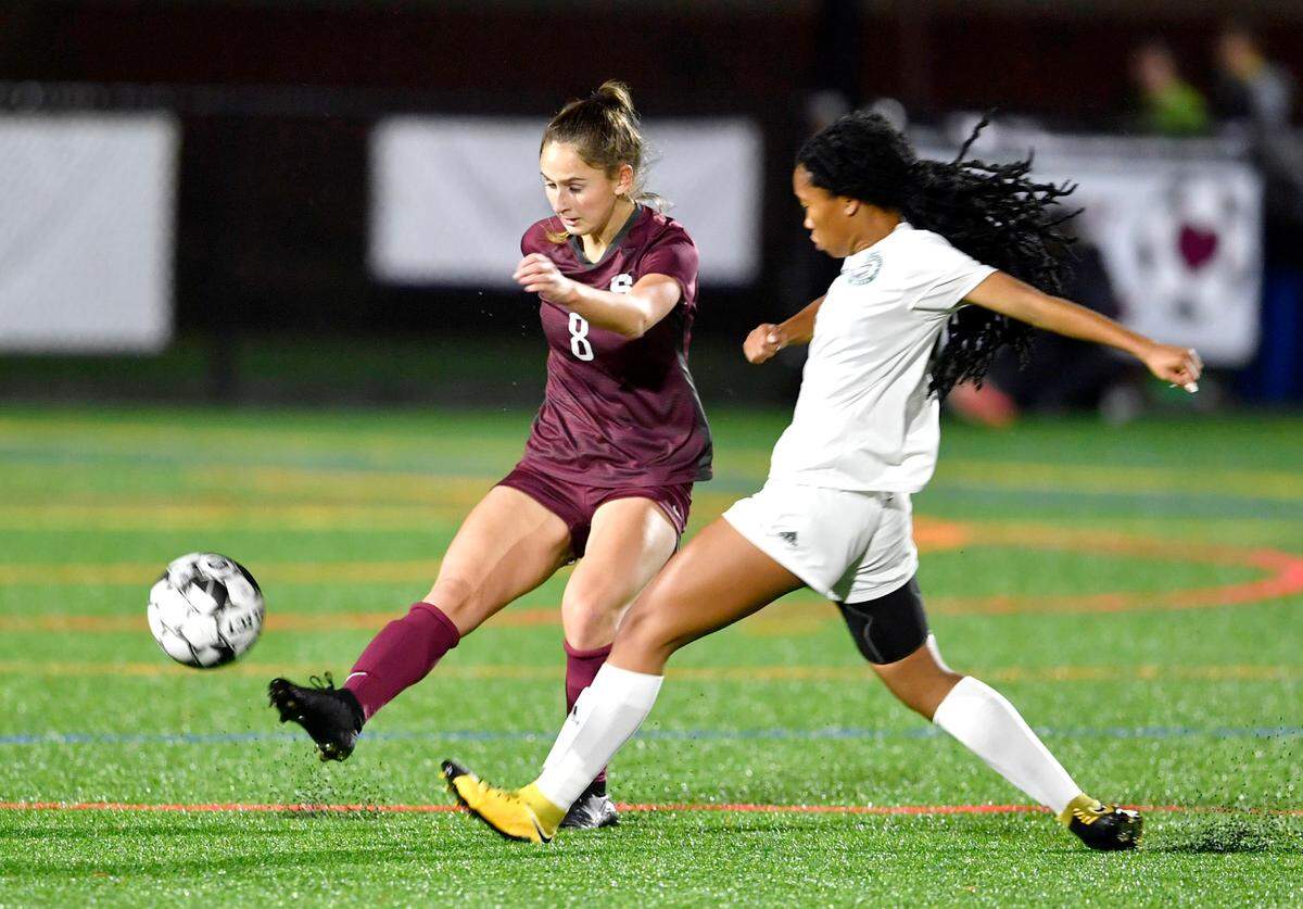 State College’s Kate Rowland kicks the ball away from a Central Dauphin player during the game on Thursday, Oct. 21, 2021.