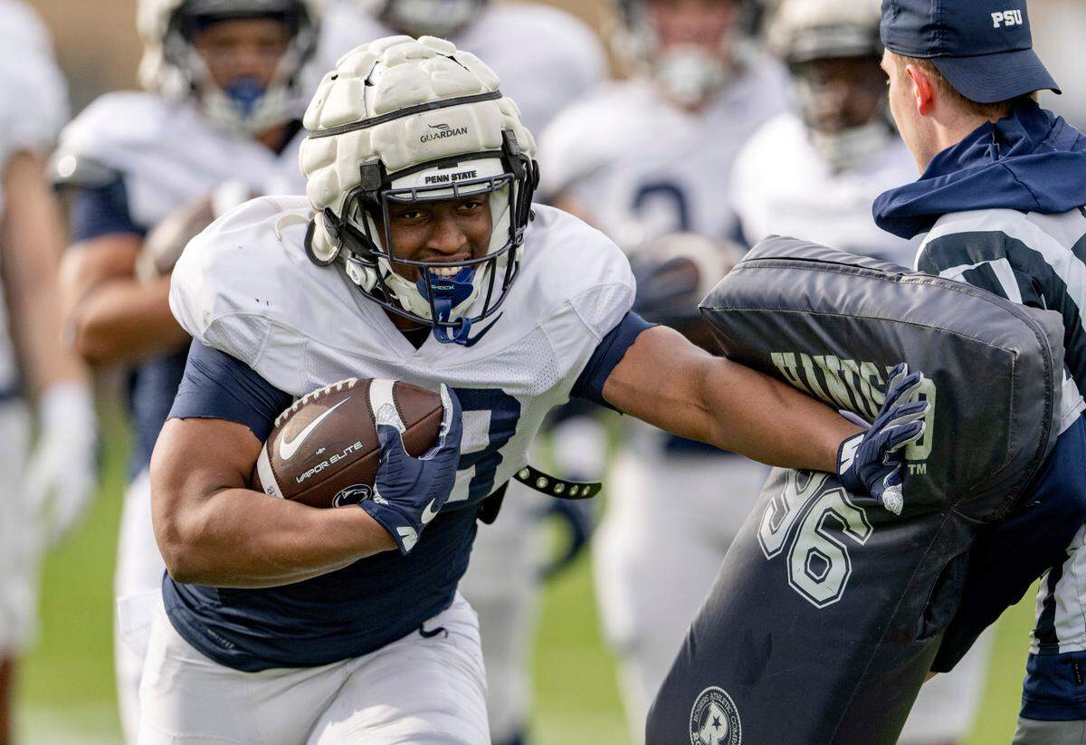Penn State running back Kaytron Allen pushes through a drill during practice on Tuesday, April 11, 2023.