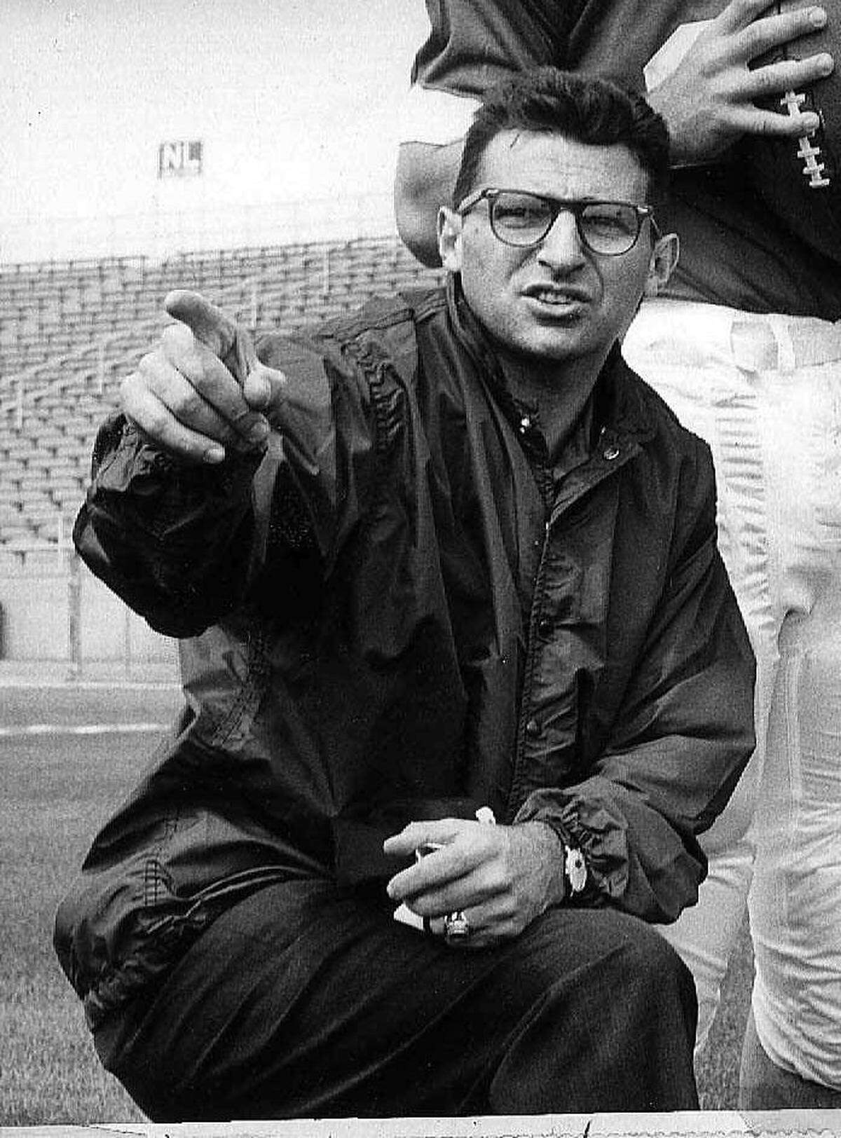 ** FILE ** Joe Paterno, associate football coach at Penn State, directs players in this Jan. 28, 1965 file photo in State College, Pa. Paterno turns 80 on Thursday, Dec. 21, 2006. (AP Photo)